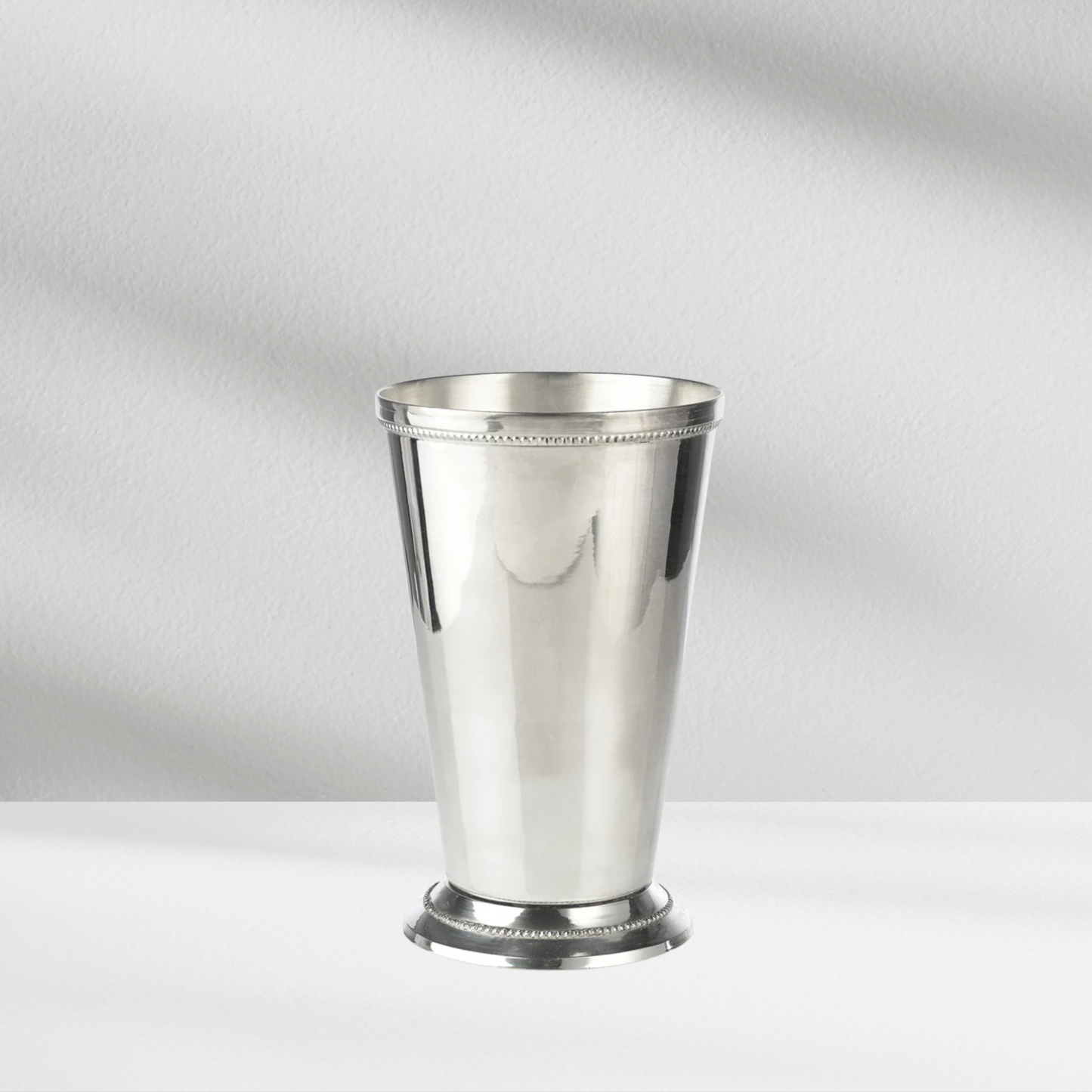The Charleston Vase (Silver) by Eos Blooms stands on a white surface against a light gray background.