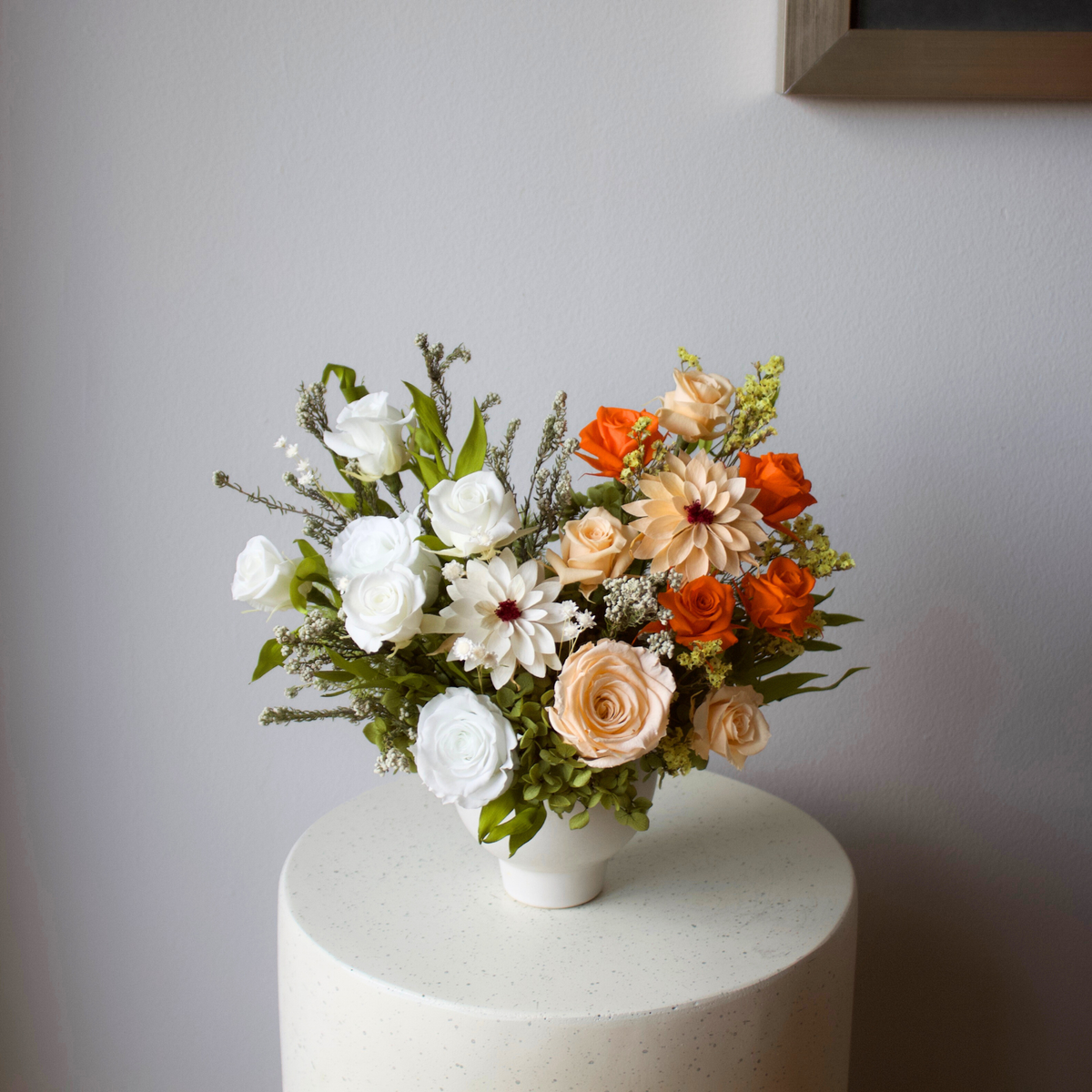 Afterglow (Petite) by Eos Blooms: preserved orange and peach blooms in a white vase.