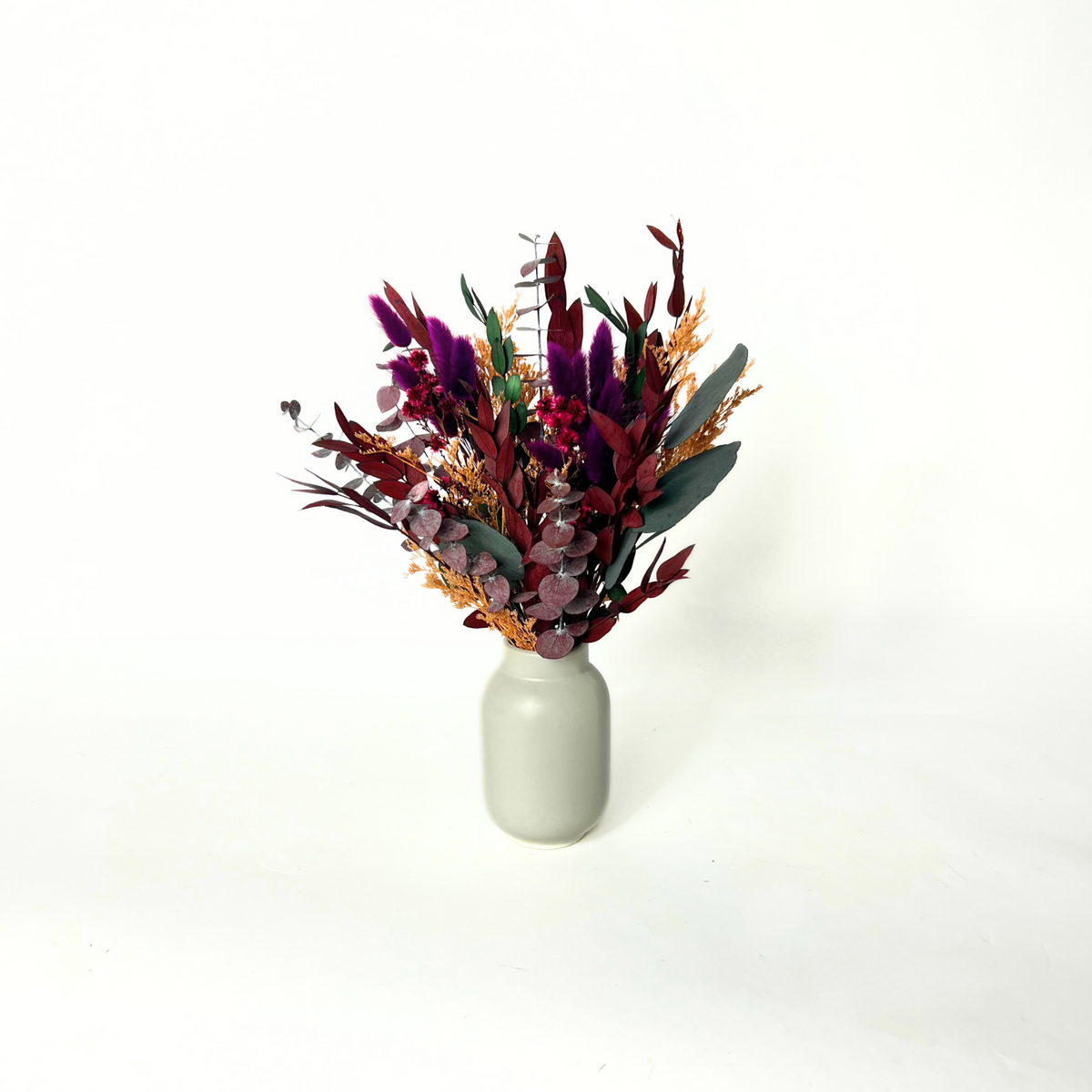 The Evelyn by Eos Blooms: a white vase with pampas and colorful preserved flowers.