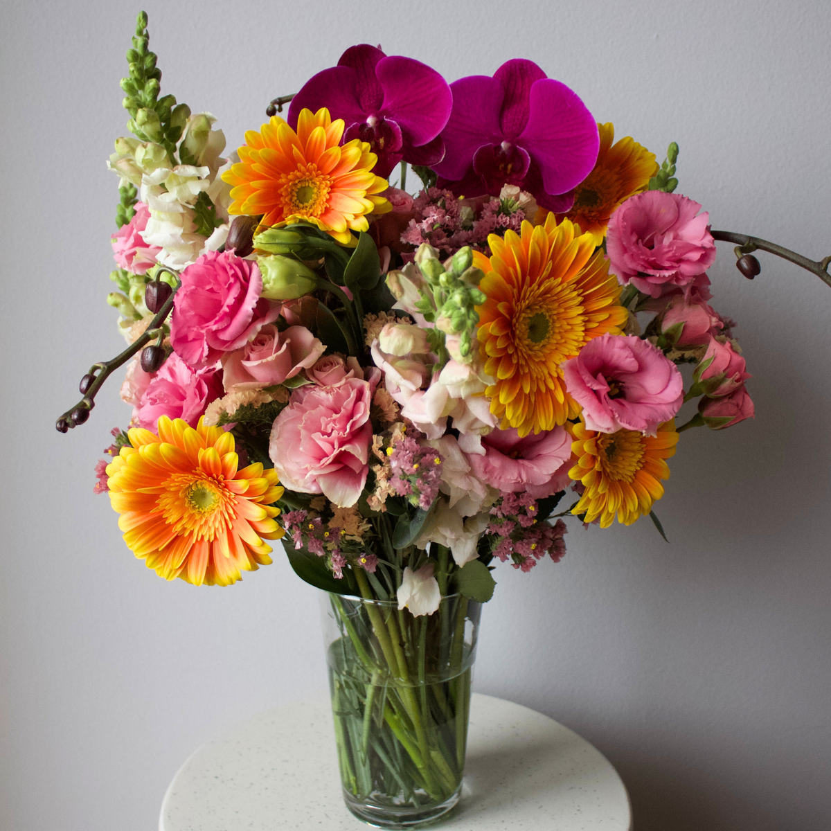 The Kindred by Eos Blooms: a pet-friendly vase with yellow gerberas, pink roses & orchids.