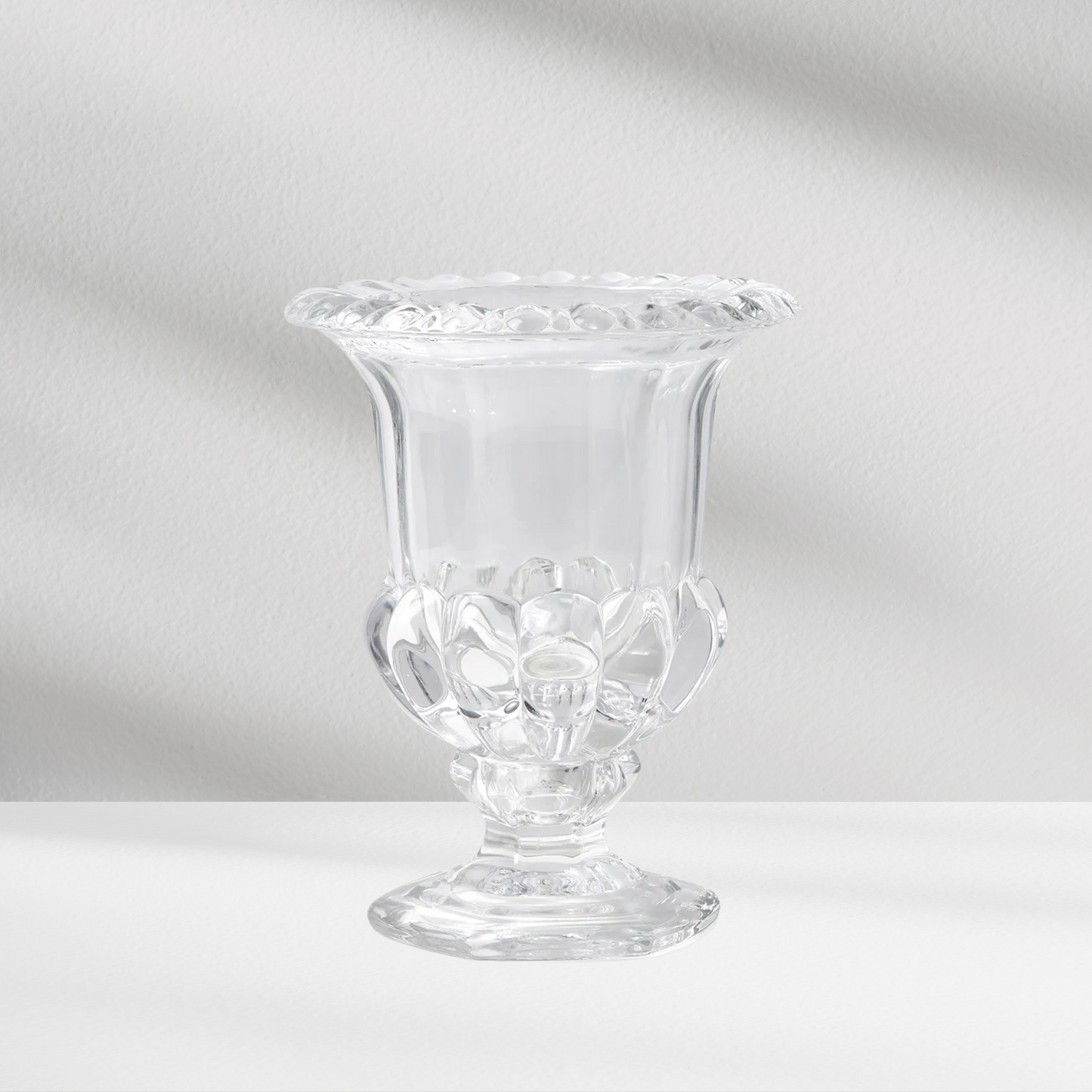 Vienna Vase by Eos Blooms with decorative rim and base on a white surface, light background.