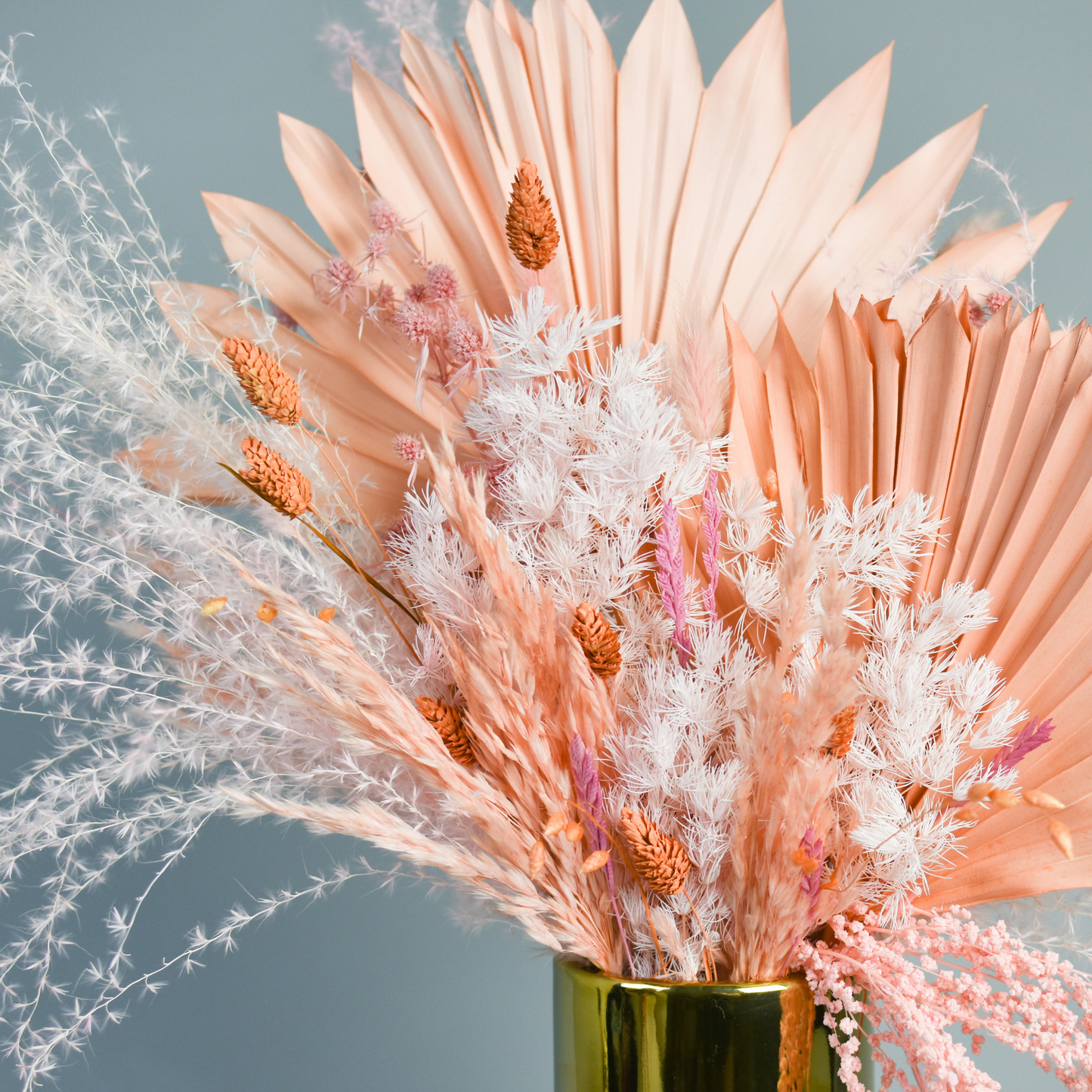 The Dune - Premium by Eos Blooms is a gold vase with pink and white preserved flowers.