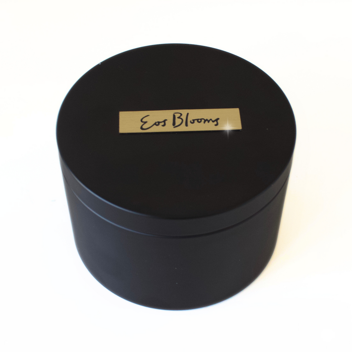 The Signature Luxe by Eos Blooms: round black box with preserved luxury roses inside.