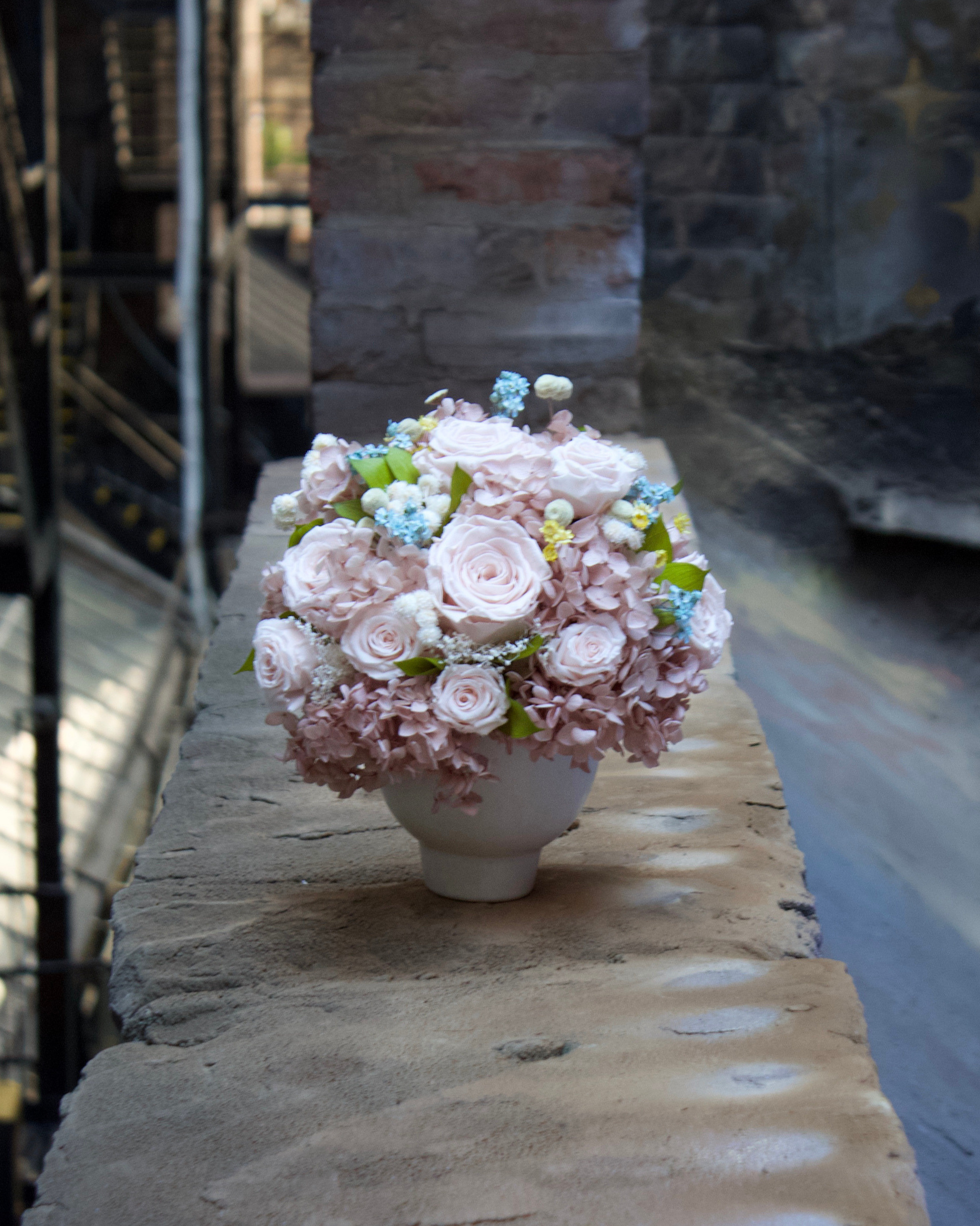 The Ballet Slipper (Petite) by Eos Blooms offers blush roses and whites—perfect for city elegance.