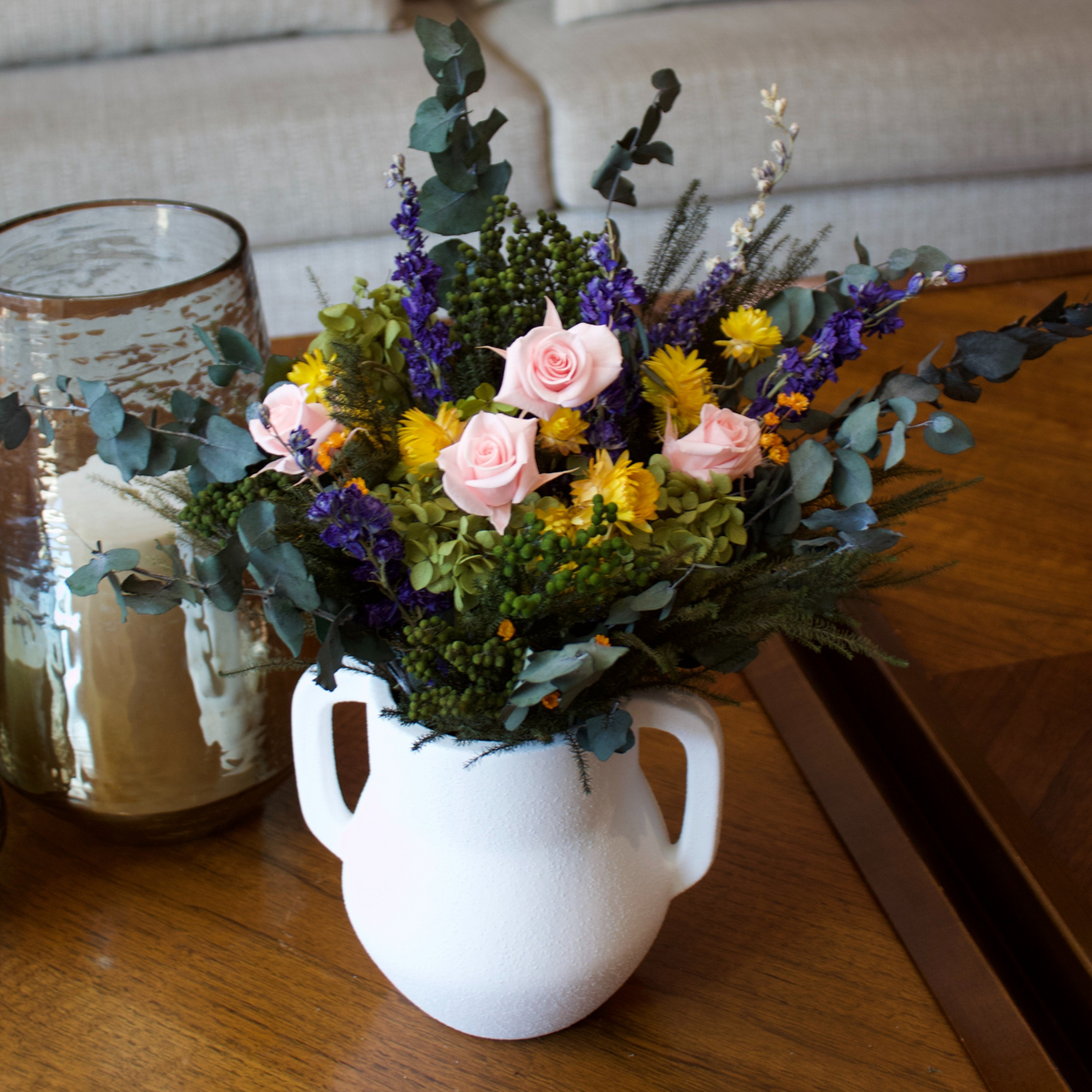 Wildbloom | Preserved Wildflowers by Eos Blooms displayed with pink roses on a wooden table.
