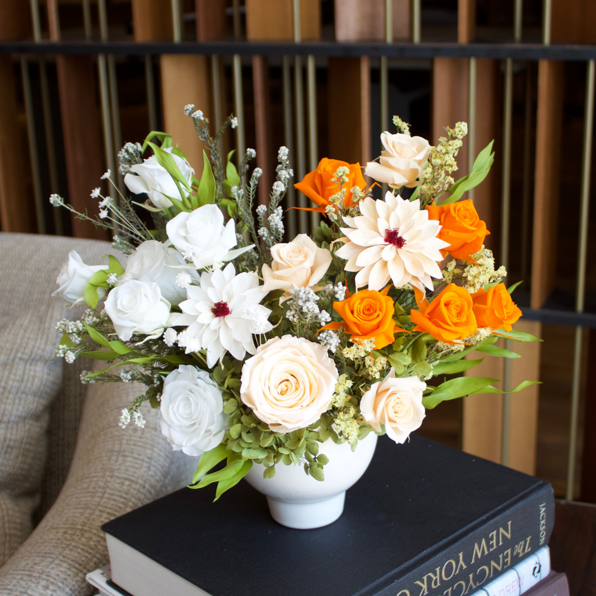 Afterglow (Petite) by Eos Blooms: a white vase with orange, white, and cream preserved flowers.