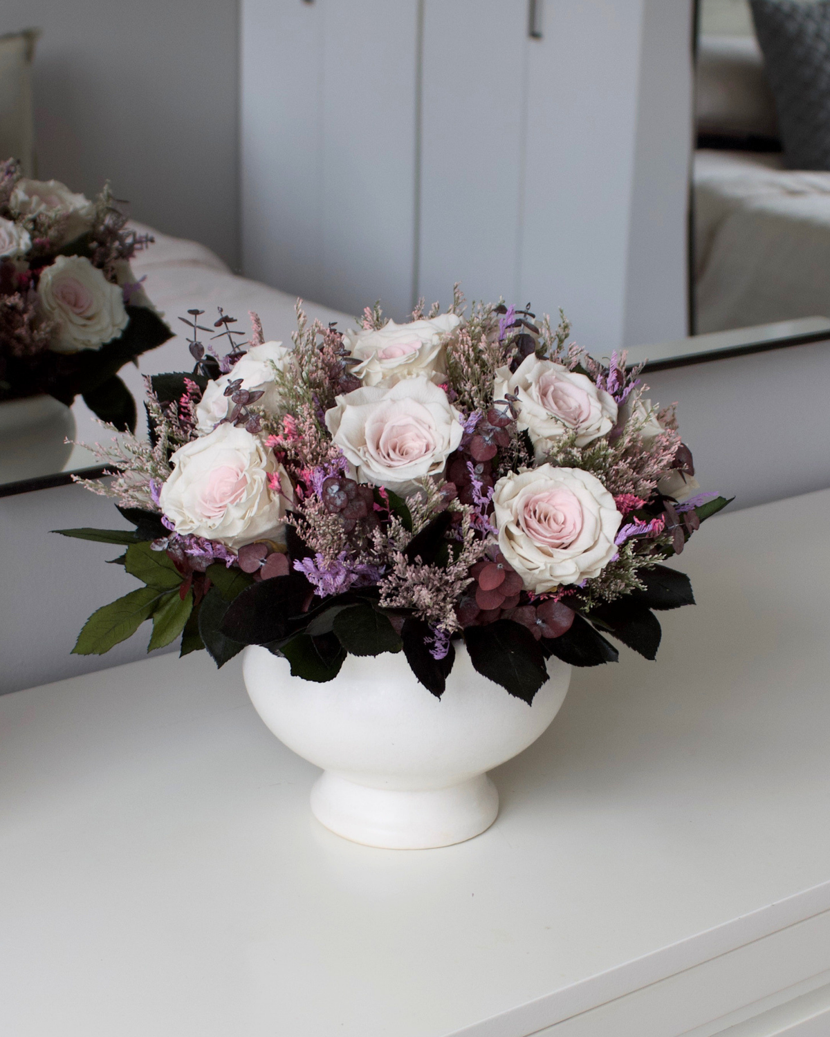 The Chantilly by Eos Blooms: light pink roses & purple preserved blooms in a white vase.