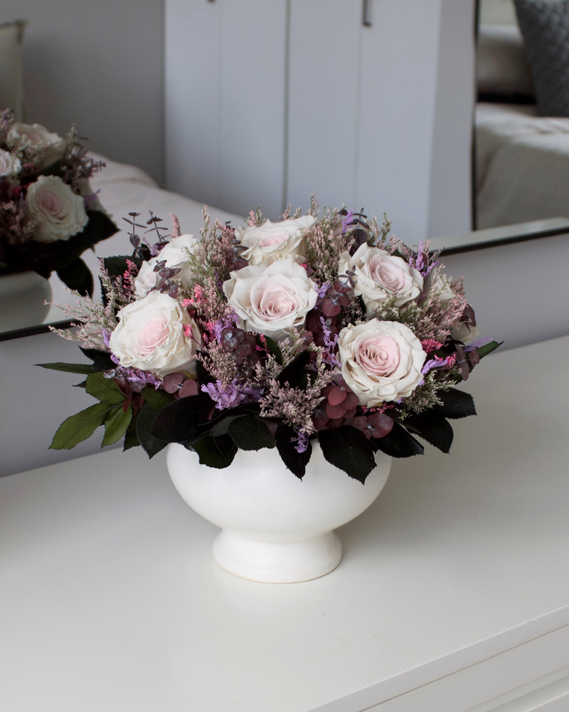 The Chantilly by Eos Blooms: light pink roses & purple preserved blooms in a white vase.