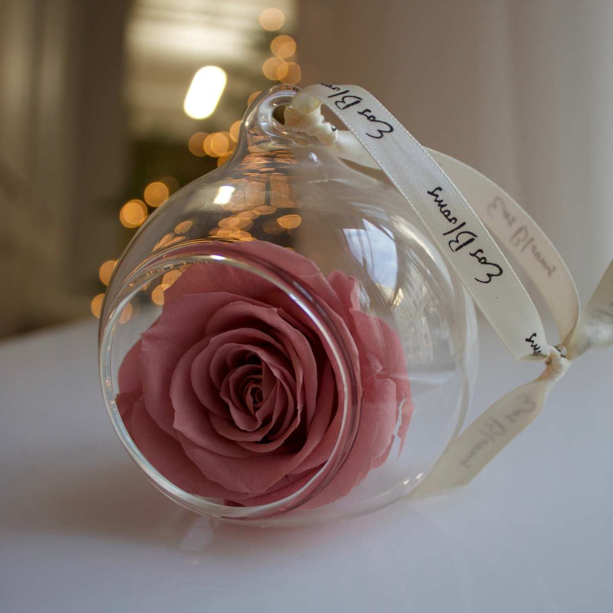 Eos Blooms Glass Ornaments 4-Pack: preserved rose decor in clear glass with ribbon.