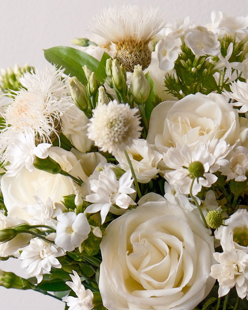 The Blanche by Eos Blooms: ivory garden roses, daisies & greens in a charming arrangement.