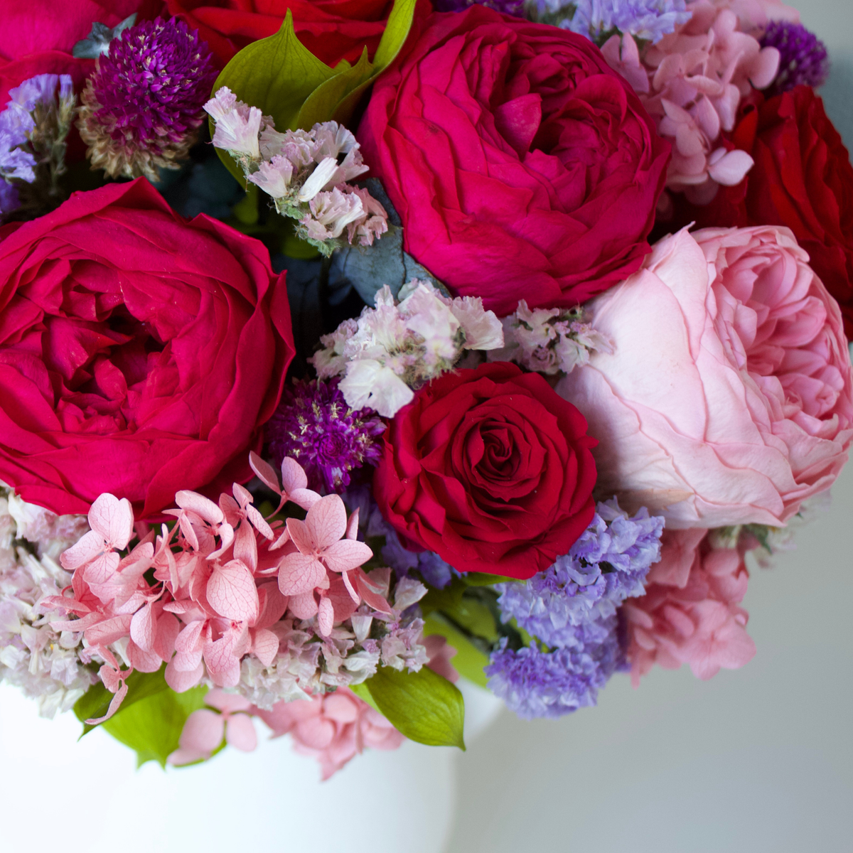 Eos Blooms' Ma Chérie: a romantic bouquet of preserved flowers and green leaves.