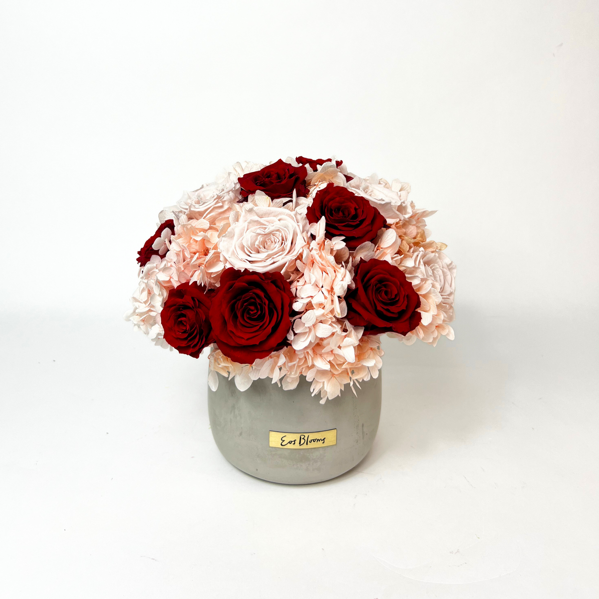 The Pixie by Eos Blooms: stone vase with preserved roses and forever flowers.