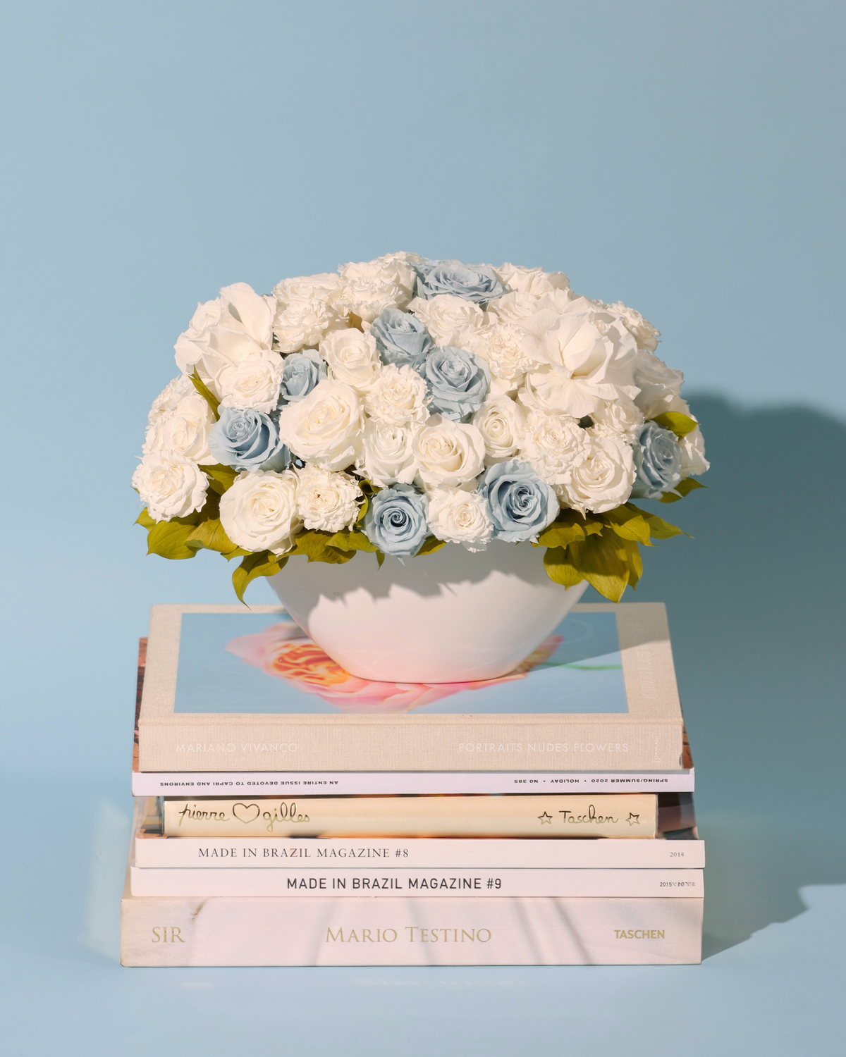 Aeterna Privé by Eos Blooms: white & blue roses in a bowl, perfect for luxe art book displays.