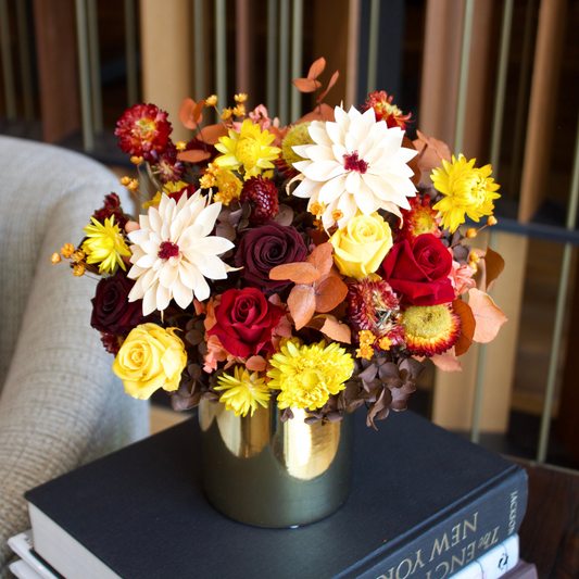 Golden Hour (Petite) by Eos Blooms, a vibrant preserved arrangement in a gold vase.