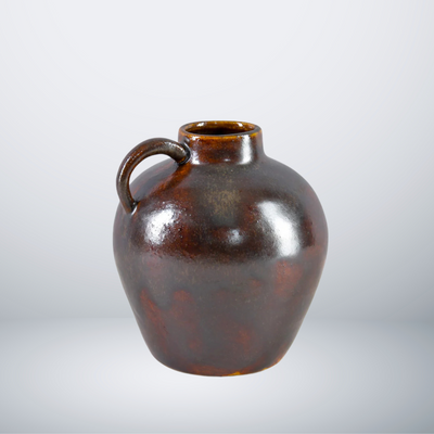 A dark brown round Kyoto Vase by Eos Blooms, inspired by aged ceramic jugs.
