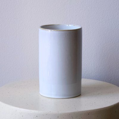 The Lennox Vase by Eos Blooms sits on a round, light-colored surface.