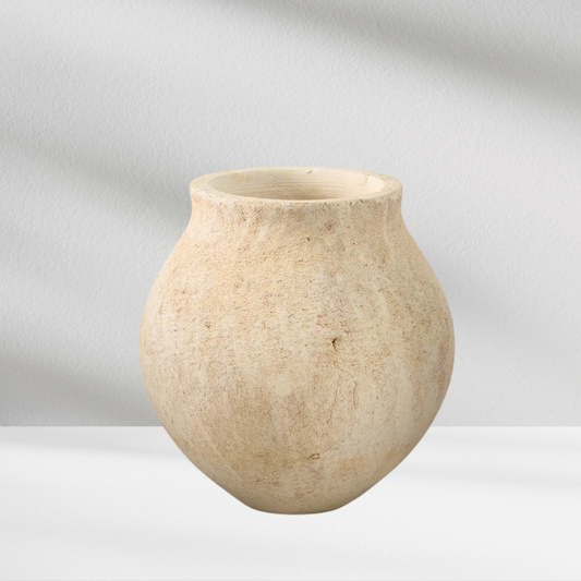 The Eos Blooms Sahara Deco Vase is a round, beige vase with a wide body and narrow opening.