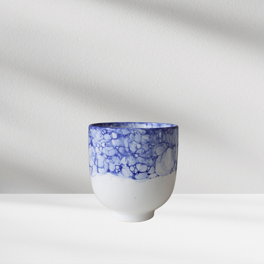 Eos Blooms’ Stella Vase features a blue bubble pattern on white, shown against a light background.