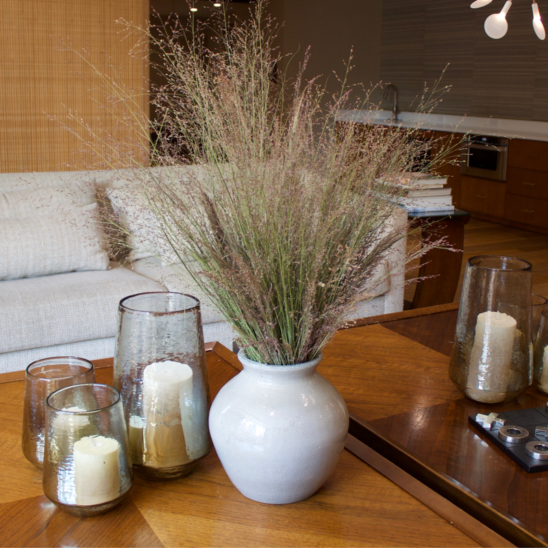 The Drifter | Preserved Switchgrass by Eos Blooms with glass candle holders on wood.