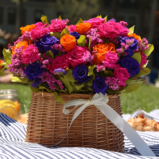 The Mariposa | Summer Basket by Eos Blooms: preserved roses, white ribbon, outdoor-ready.