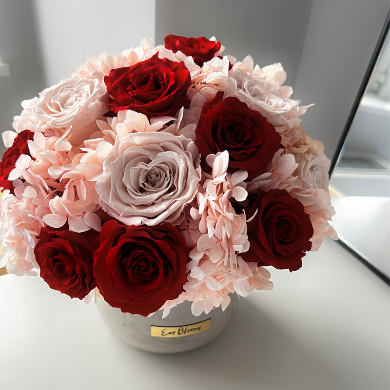 The Pixie by Eos Blooms—preserved roses in a round white vase—adds charm to any table.