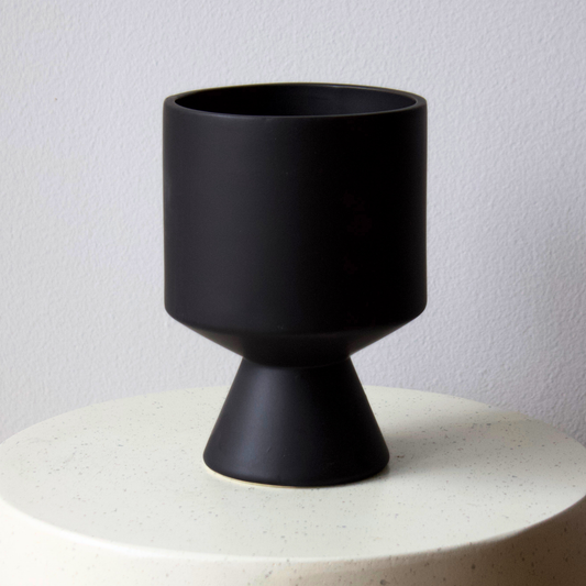 Tribeca Vase by Eos Blooms: matte black, modern pedestal vase with a conical base.